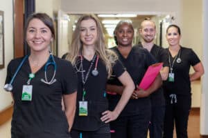 Copper Ridge staff smiling in hallway