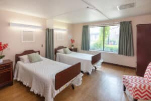 Room with two beds and curtains for privacy