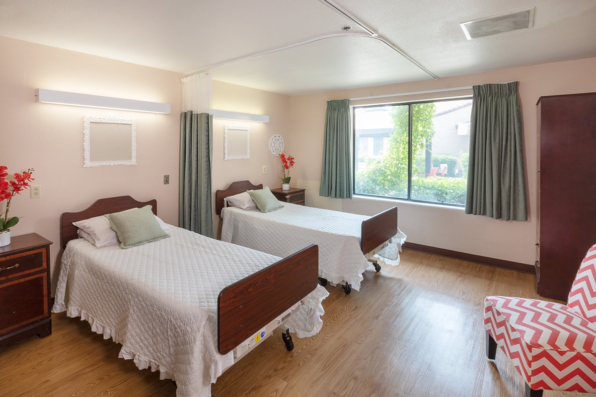 Room with two beds and curtains for privacy