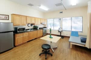 Small room with exercise equipments and kitchen