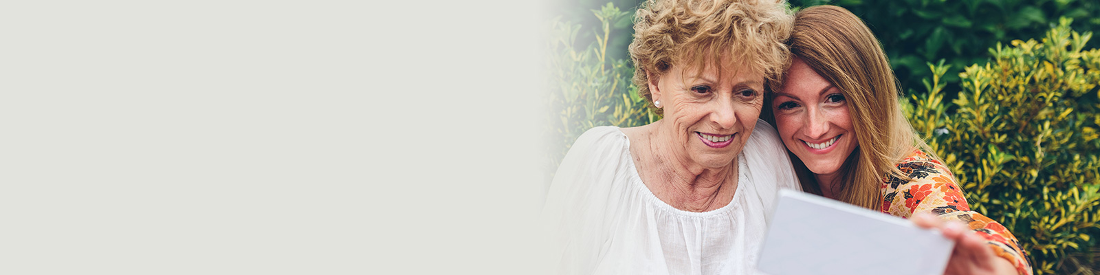 Woman taking a selfie with her mother.