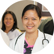 Female doctor wearing white lab coat and a stethoscope draped over her shoulders